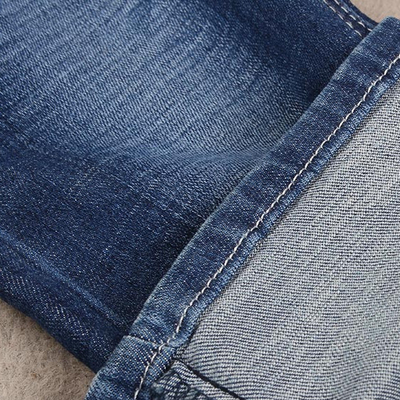 4 de Stof van het de Rekdenim van de manierlont voor de Jeans 373gsm van het Mensenmerk